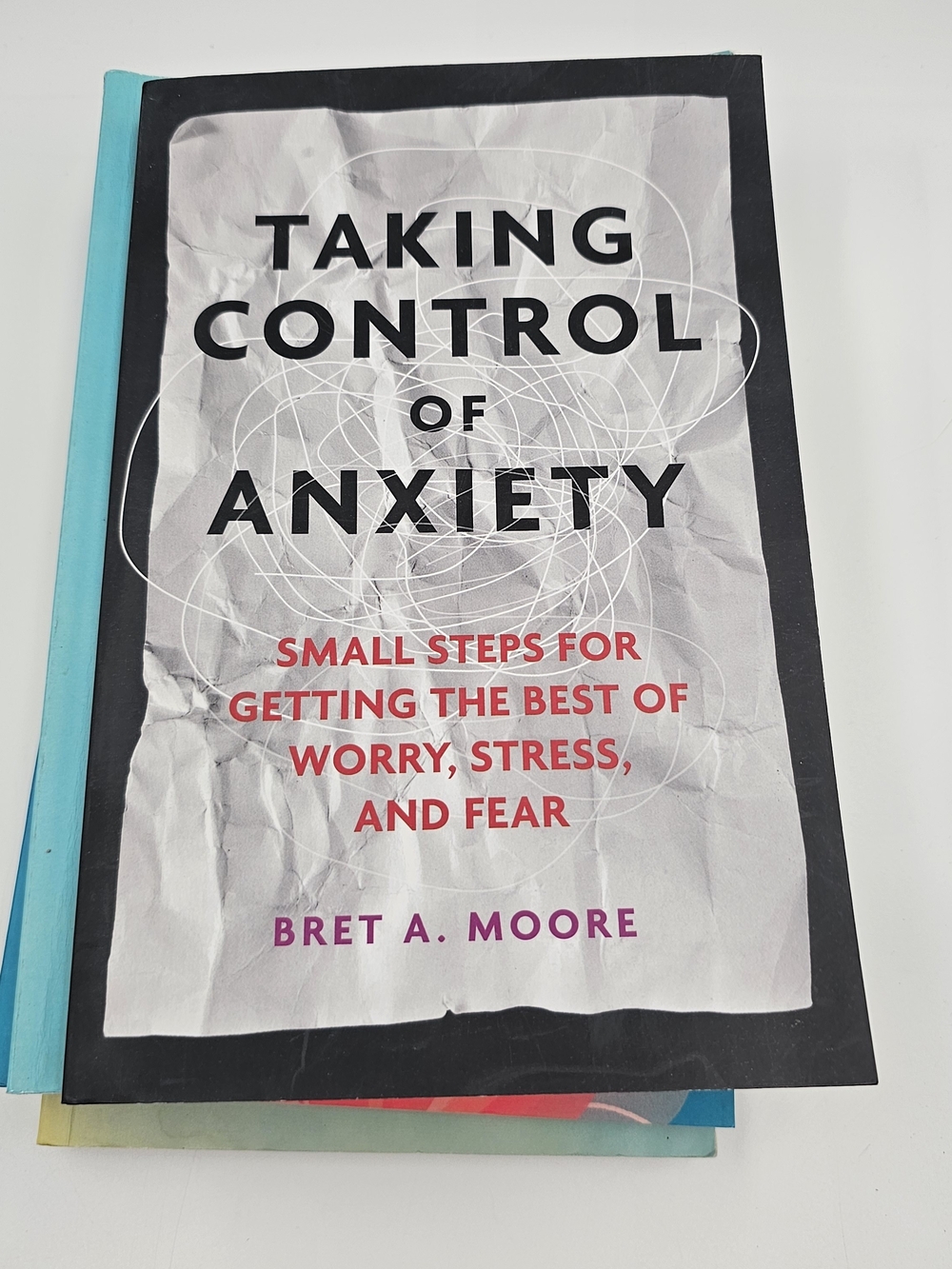 Stack of Mindfulness & CBT Books in Black, Teal, Blue, and Cream - Picture 3 of 14
